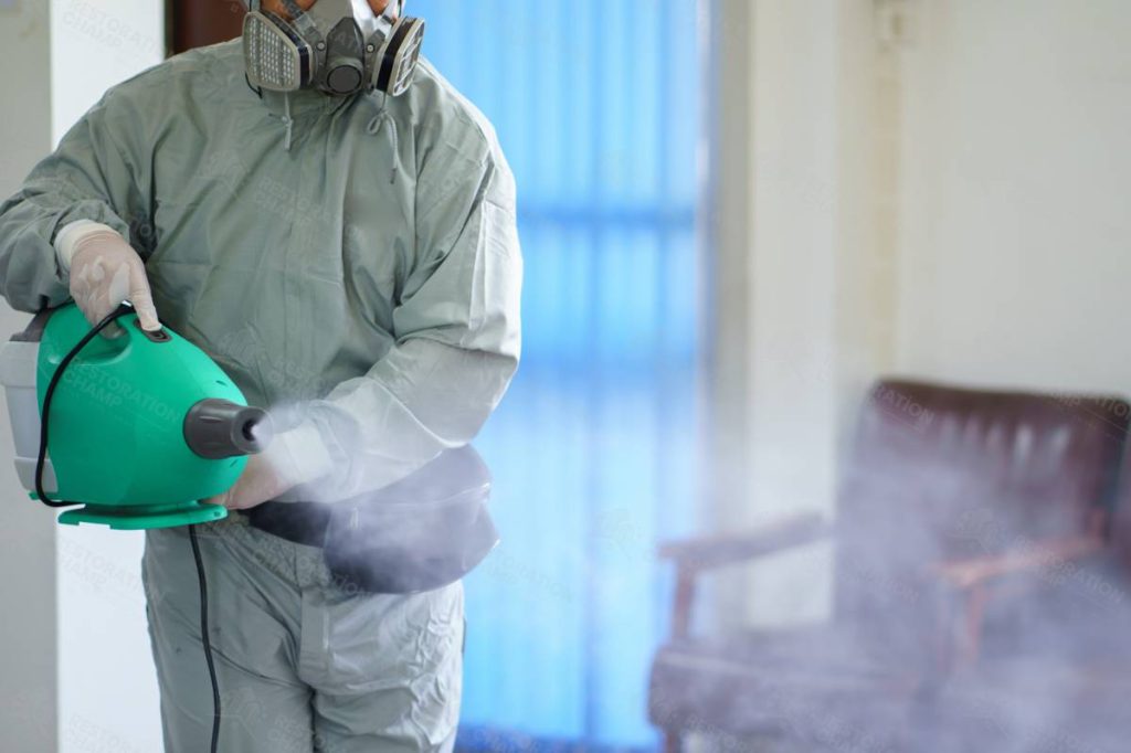 restoration-champ-hialeah-fl-decontamination-disinfection-worker-wearing-protective-suit